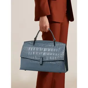A blue handbag made of exquisite and fashionable cowhide material, with a shoulder strap suitable for commuting to work and traveling, Leather Handbag