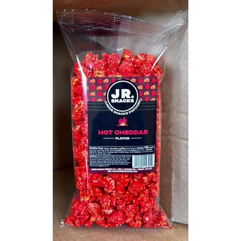 Junior Snacks Co. Hot Cheddar Popcorn; Yellow Cheddar meets our Spicy Red Seasoning