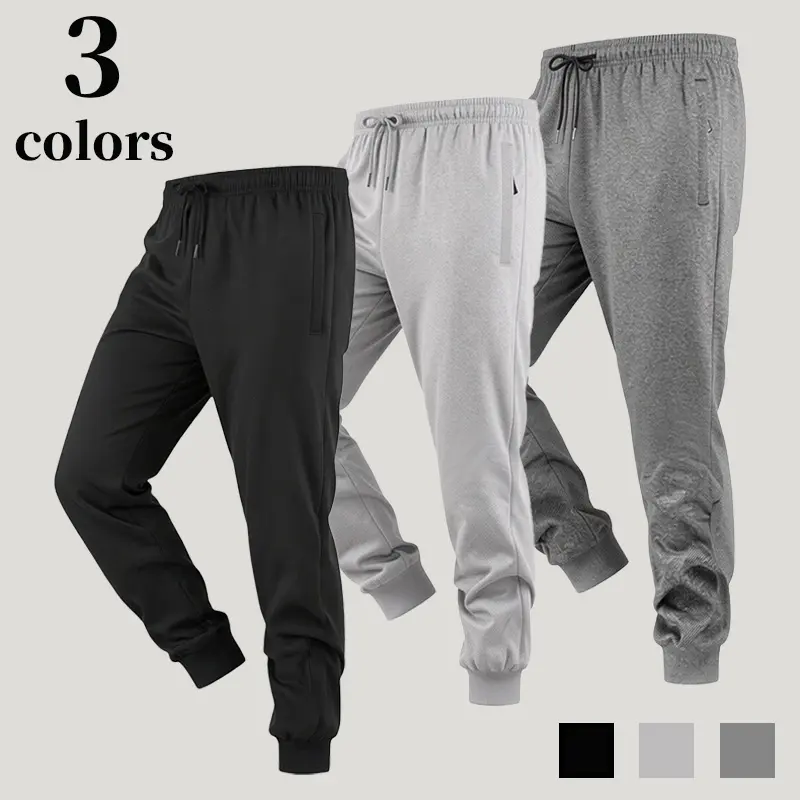 Men’s joggers with an elastic waistband, drawstring, zippered pockets, lightweight casual street athletic pants, minimalist drawstring joggers for men with ribbed cuffs and side zippers, slim-fit everyday sweatpants.