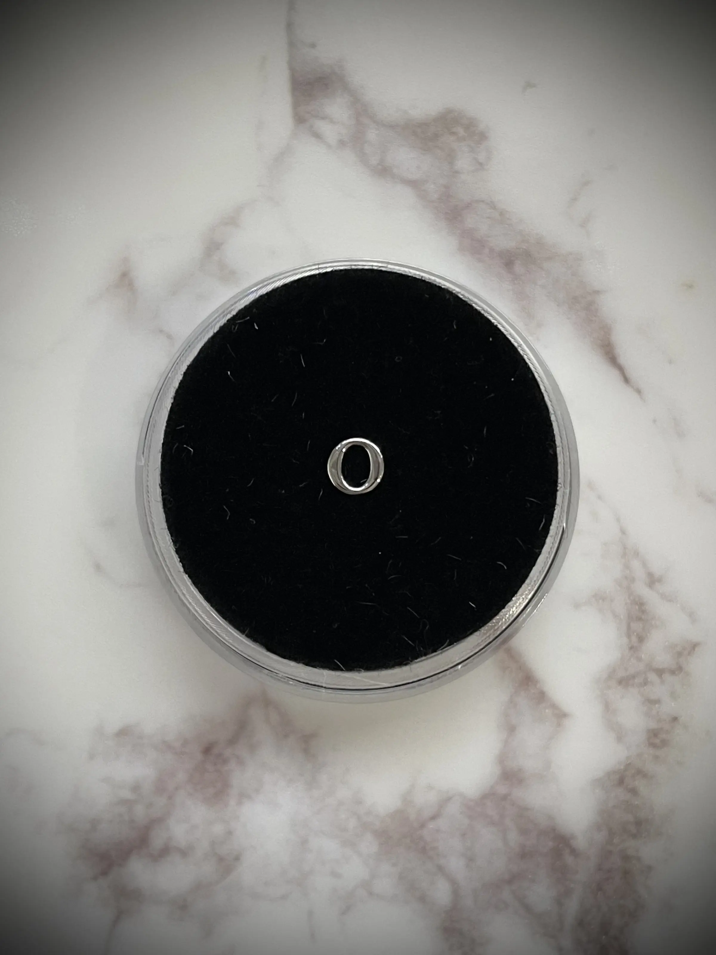 Silver “O” Tooth Gem