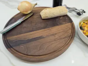 Round black walnut cutting board