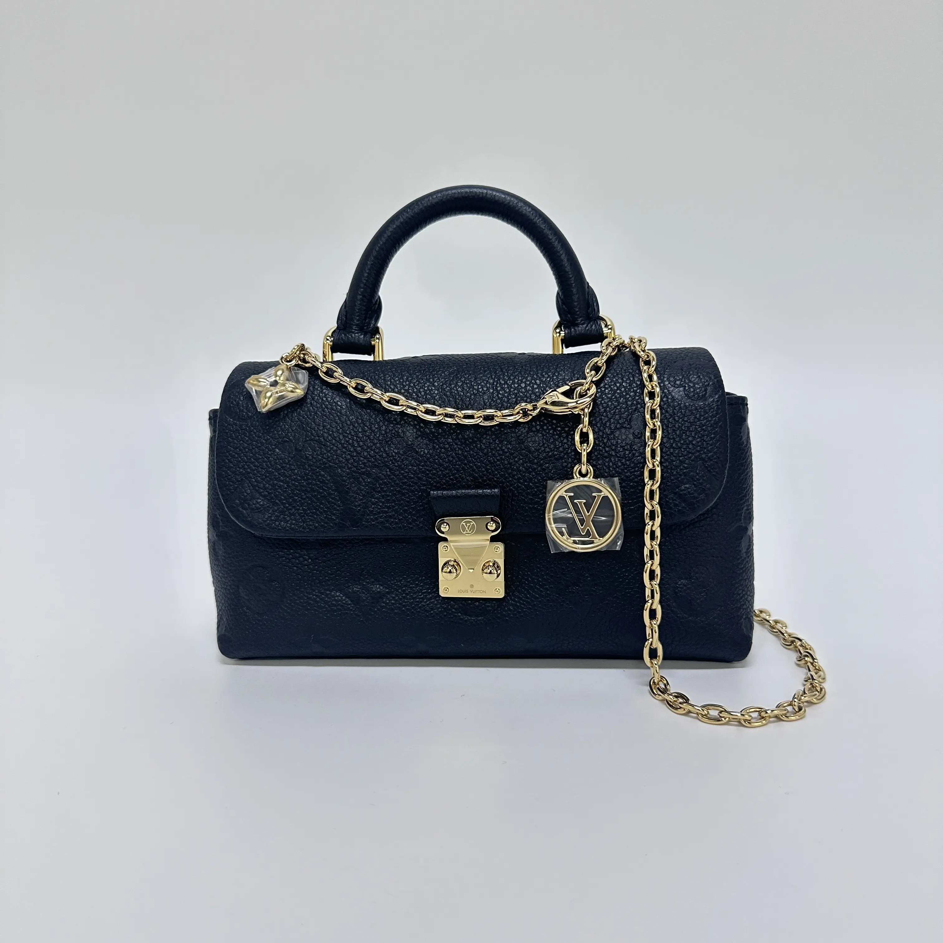 Pre-owned Louis Vuitton Black Elegant Embossed Leather Nano Madeleine Top Handle Crossbody Bag Minimalist, Chic Fashion, Lightweight Everyday Crossbody Bag, Compact