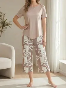 Women’s summer casual two-piece set featuring a unique design: solid-color short-sleeve top paired with leaf-print seven-eighths wide-leg pants with pockets. High stretch fabric | cool, silky feel | available in three colors. Women’s loungewear, women’s p