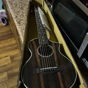 Limited Edition Guitar - The Productictured with No Additional Specifications or Features Provided  It is half scale