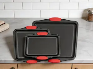 3-piece nonstick baking pan set with red silicone handles. Durable steel bakeware, easy-clean design for daily oven use.
