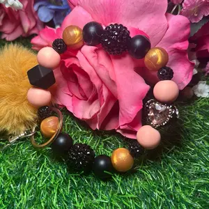Peach Queen wristlet keychain color scheme black, peach, golden and bling silicone beads made with wire
