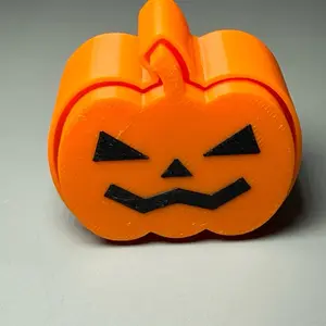 2 Inch Tall Pumpkins Clicker Fidget - Orange Shape with Black Face Design