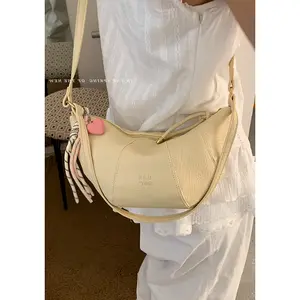 Fashionable Beige Handbag - Heart-Shaped Charm with Colorful Tassel Detail - Perfect for Everyday Style