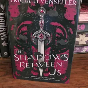 The Shadows Between Us by Tricia Levenseller (Special Edition Hardcover with Stenciled Edges)