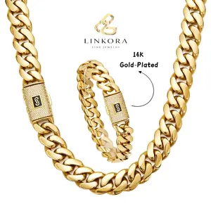 Bold Miami Cuban link necklace set featuring a sparkling clasp; 14K gold-plated; hip-hop style, perfect for streetwear and everyday looks.