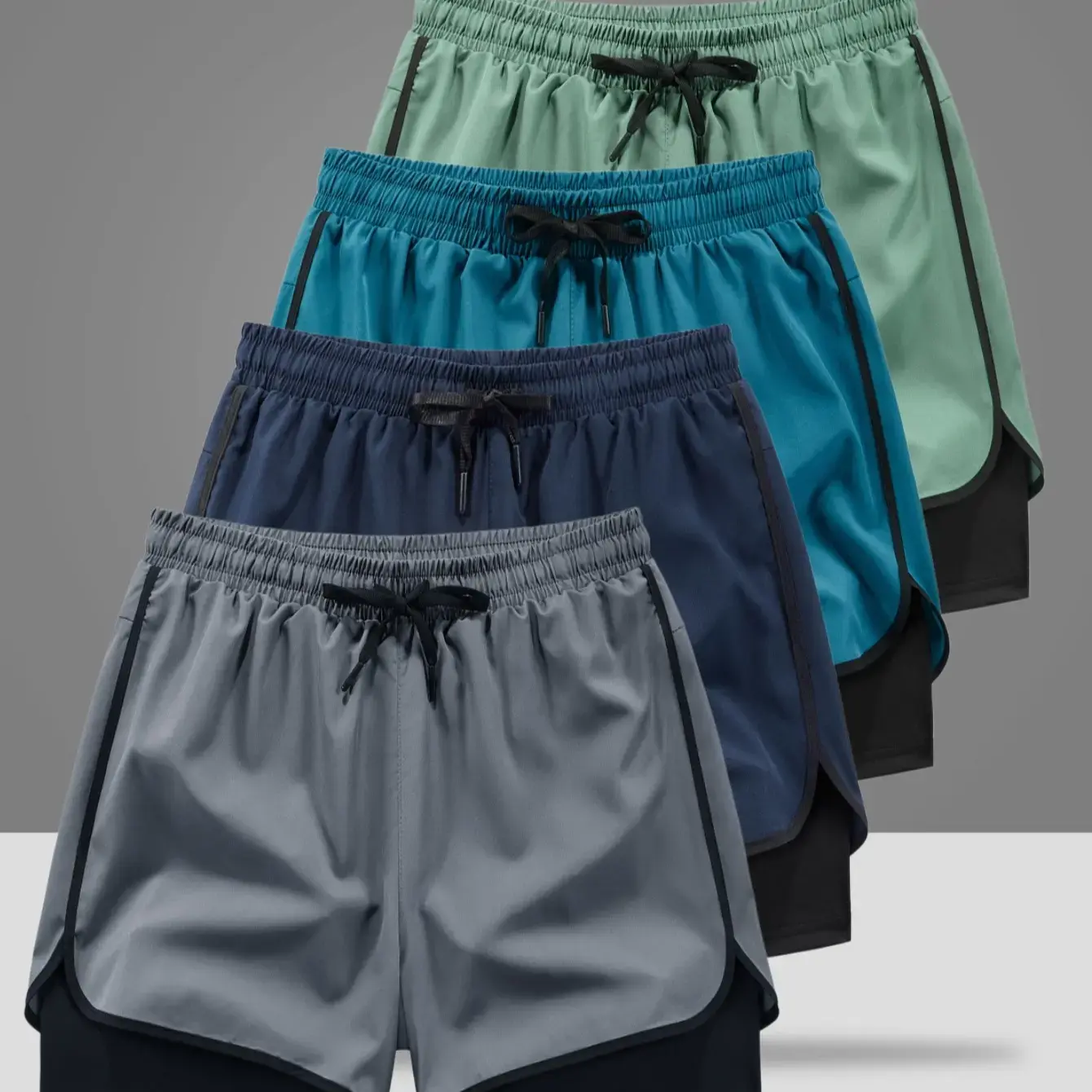 Pack of 4 men’s athletic shorts featuring a double-layer design. The inner layer is made from breathable, quick-dry fabric, while the outer layer is more relaxed fit—ideal for running, workouts, and everyday casual wear.