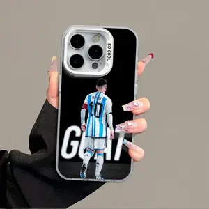 A silver phone case featuring the number 10 on the back of a Messi jersey, compatible with iPhone 17, 16, 15, 14, 13, and 12. It's a shockproof protective case.