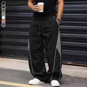 Men’s high-street wide-leg pants featuring contrast panels, side stripes, and a drawstring; American retro loose, drapey athletic pants; slim casual pants suitable for autumn, winter, and summer. Men's long pants, solid color