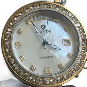 Croton Ladies Watch with Automatic Movement, White Dial, Gold-Tone Case, and Decorative Crystal Accents