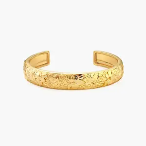 en route Serenade of Orchid Bangle in Gold, 3D Flower Shape featuring Intricate Petal Details, Smooth High Shine for Polished Look, Modern Botanical Aesthetic, Perfect for Weekend Brunch or Vacation Style