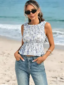 Fresh Blue White Floral Print Smocked Peplum Vacation Sleeveless Blouse Trendy Blue White Floral Smocked Cropped Statement Vacation Top Elegant Blue White Floral Smocked Peplum Resort Sleeveless Blouse Women