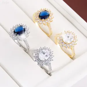Gold/Silver Tone Halo Crystal Ring, Oval Cut Sapphire/Clear Simulant with Sunburst Setting, Tarnish-Resistant Statement Jewelry for Formal & Everyday Wear
