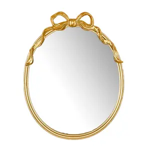 Gold Oval Mirror Accent Bow