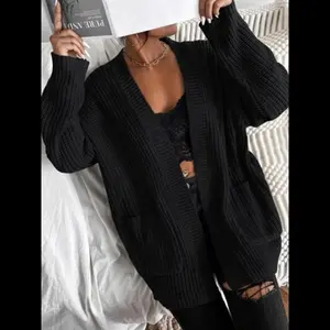 Women's Halloween themed plain pocket cardigan, casual long sleeved cardigan, women's cardigan, women's loose knit fabric, suitable for daily wear in autumn