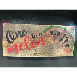 One in a melon repurposed wooden door sign