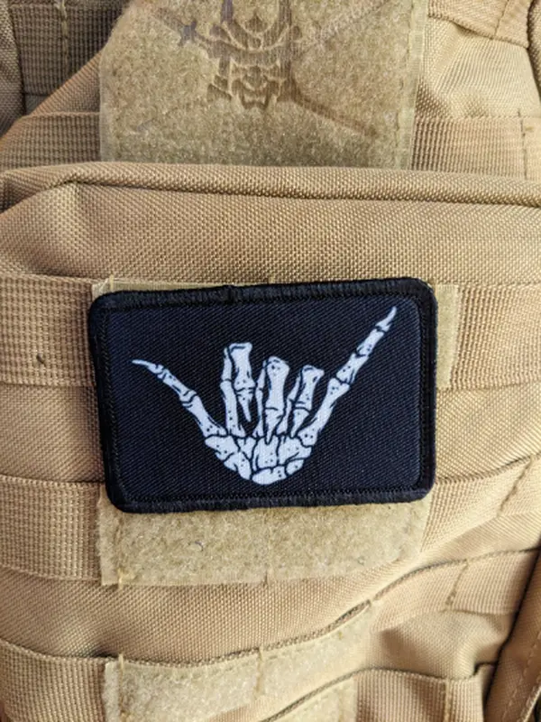 Bone shaka punk rock goth joke 2"x3" white morale patch with hook and loop backing Bone shaka punk rock goth joke 2"x3" white morale patch with hook and loop backing