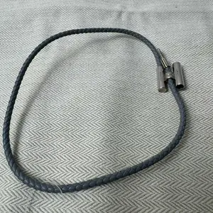 Pre-owned HERMÈS Palladium Bag Accessories Tournis Tresse bracelet in gray leather with plated hardware