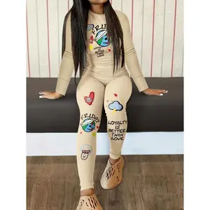 Graffiti Printed Two-Piece Set — Casual two-piece set featuring a graffiti-printed round-neck long-sleeve top and high-waisted pants — women’s clothing
