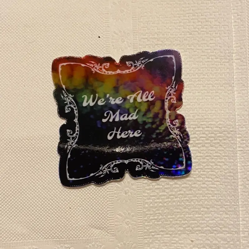We’re All Mad Here Holographic Sticker