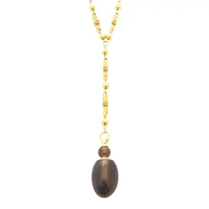 Smoky quartz crystal perfume vial pendant and gold chain necklace