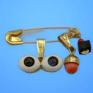 Azabache protection pin with Brown Santa Lucia eyes