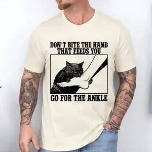 Don't Bite The Hand That Feeds You, Go For The Ankle T Shirt | Satirical Meme Graphic Tee, Funny Humor Playful Parody Attitude | Quirky Sarcastic Lighthearted Comedy Aesthetic | Unisex Casual Graphic T Shirt For Men And Women