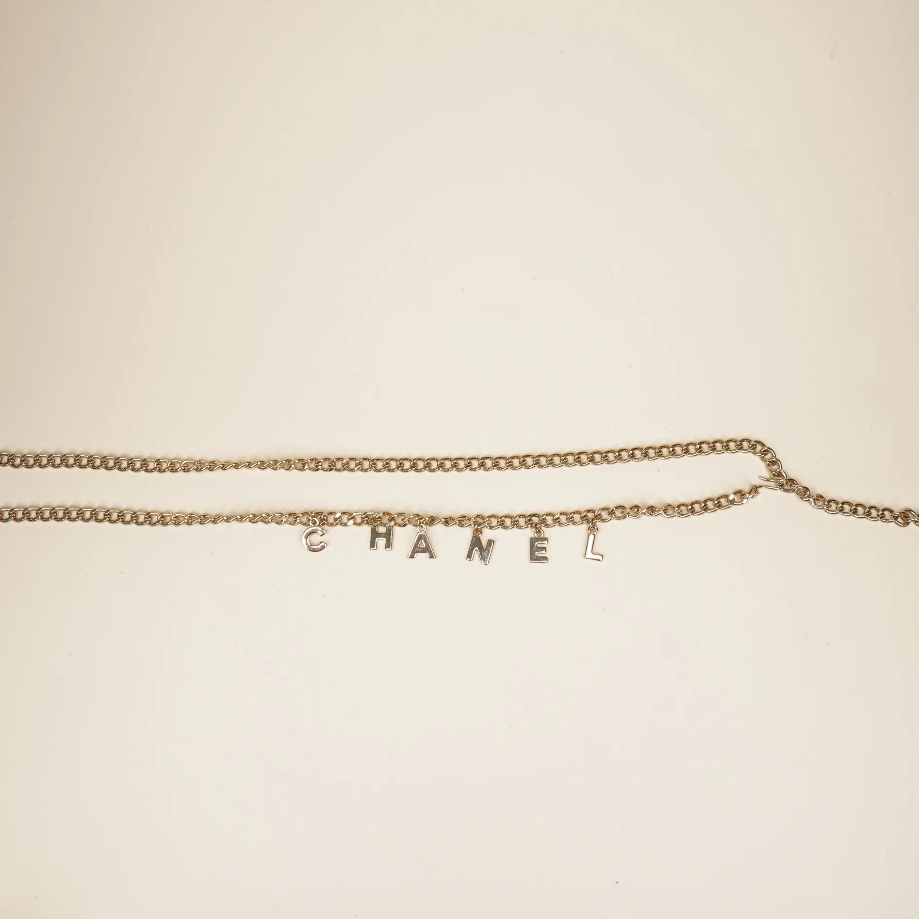 Pre-owned CHANEL Letter Drop Chain Belt Light Gold Tone
