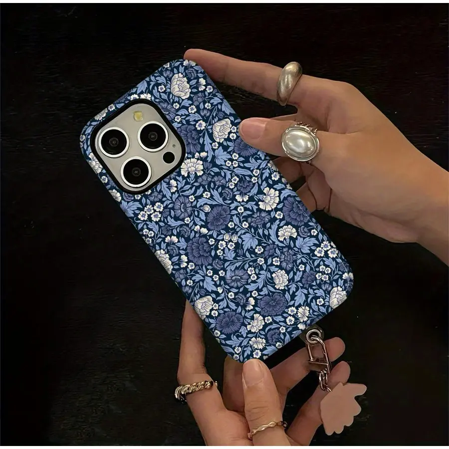 This durable, shock-absorbing, glossy 2-in-1 phone case features a retro blue floral design and is compatible with iPhone 17, 16, 15, 14, 13, 12, 11, X, and Samsung models. It makes a great holiday gift for friends or family.