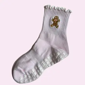 Light pink ruffle gingerbread man holiday grip sock for Pilates, Yoga, Barre or lagree