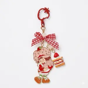Strawberry Shortcake Sweet Bow Keychain Charm - Adorable Strawberry Cake & Checkered Bow Detail - Shiny Gold-Tone Finish - Durable Zinc Alloy - Perfect for Bag Pendant Keyring or Collectible Accessory