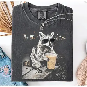 Raccoon Drinking Iced Coffee Funny Graphic Tee, 100% Cotton Oversized Comfort Outfit, Coffee Lover Meme Cute Fashion Shirt, Perfect Valentine's Day Gift For Him Her Family Friends