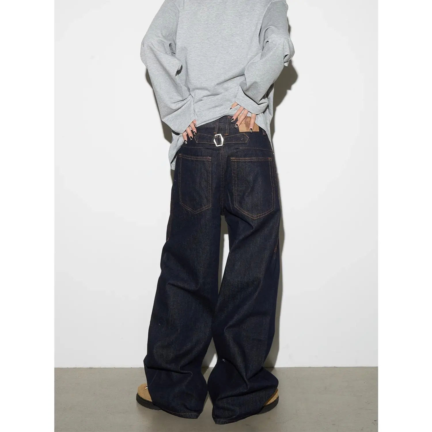 Premium raw denim wide-leg jeans, unique metal buckle detail on the back waist for a standout street style. Contrast stitching with a relaxed baggy fit, perfect for urban casual and high street looks. # WideLegJeans # BackBuckleDenim # RawDenim