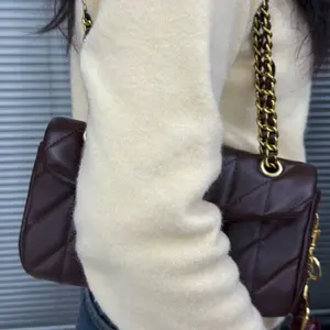 Vintage brown underarm bag, women's lychee-texturedcowhide shoulder bag with crescent lock clasp.