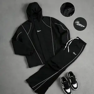 American high-street windproof two-piece set — hooded jacket + long pants, featuring a striped color-block design, letter print, and high-density windproof waterproof fabric, with reinforced stitching. Wear-resistant, wrinkle-resistant, and perfect for ev