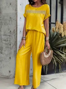 Two-piece yellow Woven lace patchwork short-sleeved top and loose wide-leg pants, elegant, versatile, suitable for daily commuting and vacation wear.