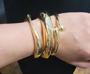Chunky and bold gold plated bangle bracelet.