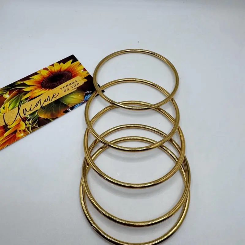 Oshun Bangles . Set of 5 Oshun bangles. Stainless steel material. High quality .