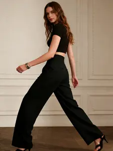A women's black wide-leg casual pants, high-waisted, draped, and loose-fit, ideal for office wear, versatile for all seasons, suitable for home, indoor, and outdoor outfits