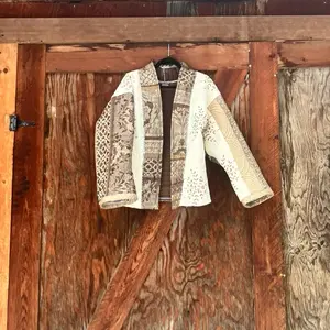 Brown and tan quilt jacket with floral accenting