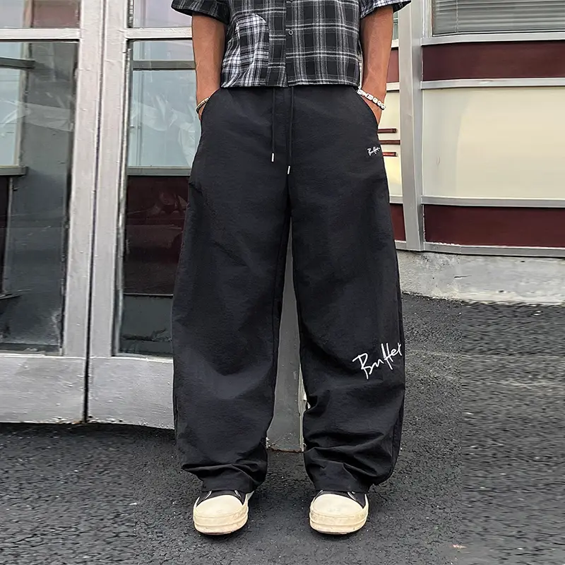 1 piece men’s summer–autumn wide-leg casual pants featuring handwritten letter minimalist print, drawstring elastic waistband, component detailing; suitable for outdoor activities, shopping, commuting, and everyday wear; loose drape, straight-cut cargo pa