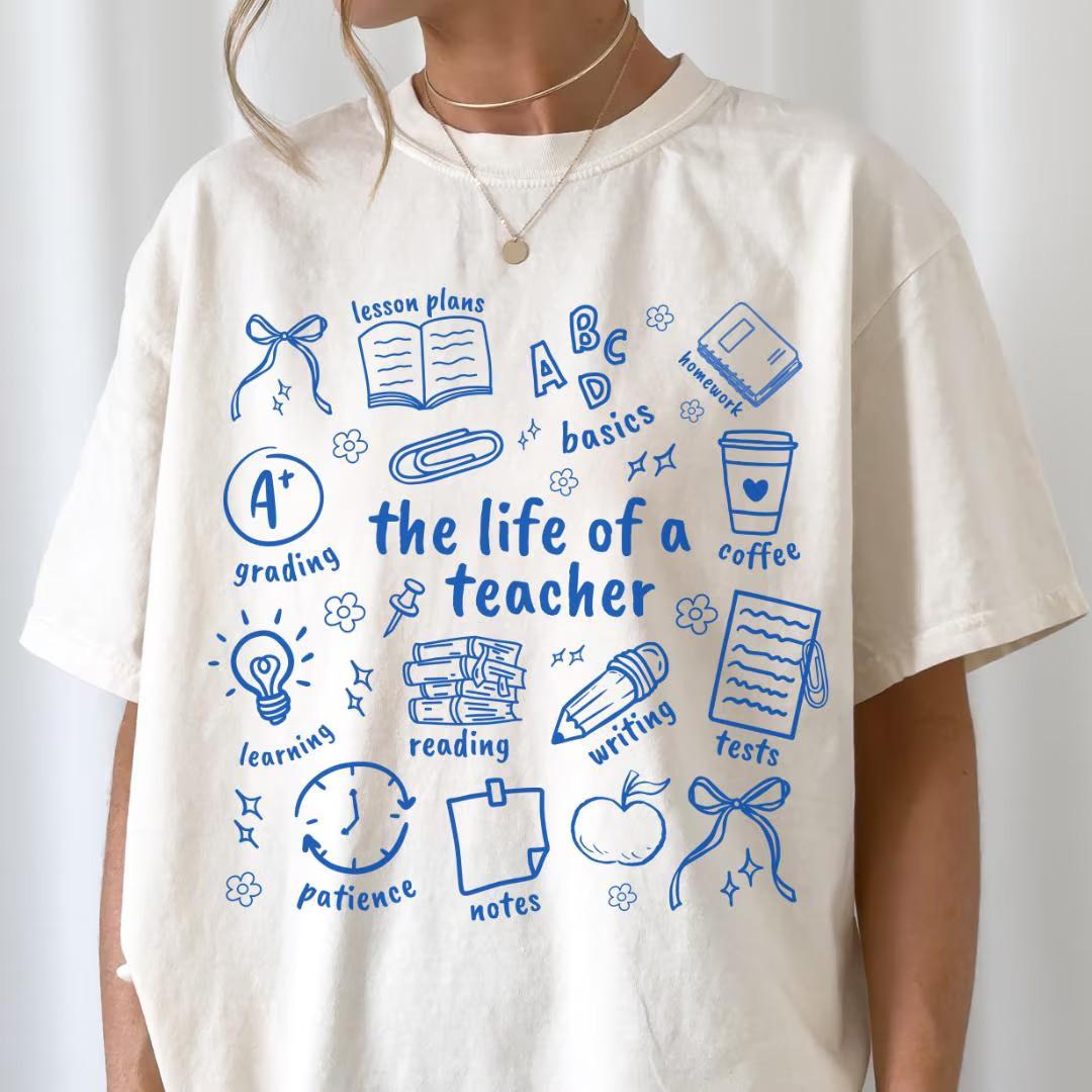 Comfort Colors The Life Of A Teacher T-Shirt, Back To School Teacher T-Shirt, Funny Educator Graphic Tee, Cute Elementary School Classroom Outfit, Inspiring Teacher Appreciation Gift For Women & Men, Trendy Teacher Life Casual Everyday Top