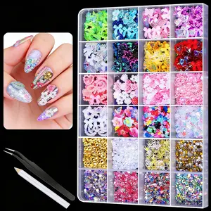 24-piece net-style nail decoration sets, including various shapes of flat-backed AB-type nails, golden pearls, and 3D Halyana flower ornaments from the 2000s style. Suitable for creating fashionable nail art and DIY handmade decoration sets.