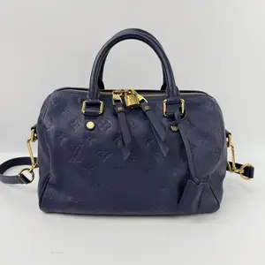 Pre-owned Louis Vuitton leather top handle bags Empreinte Speedy Bandoulière navy bule Monogram Handbag with Gold Hardware