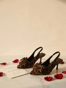 Women's Leopard-Print Slingback Pumps — Pointed-Toe, Bow Accent, Slim Low Heel — Elegant Evening & Party Dress Shoes