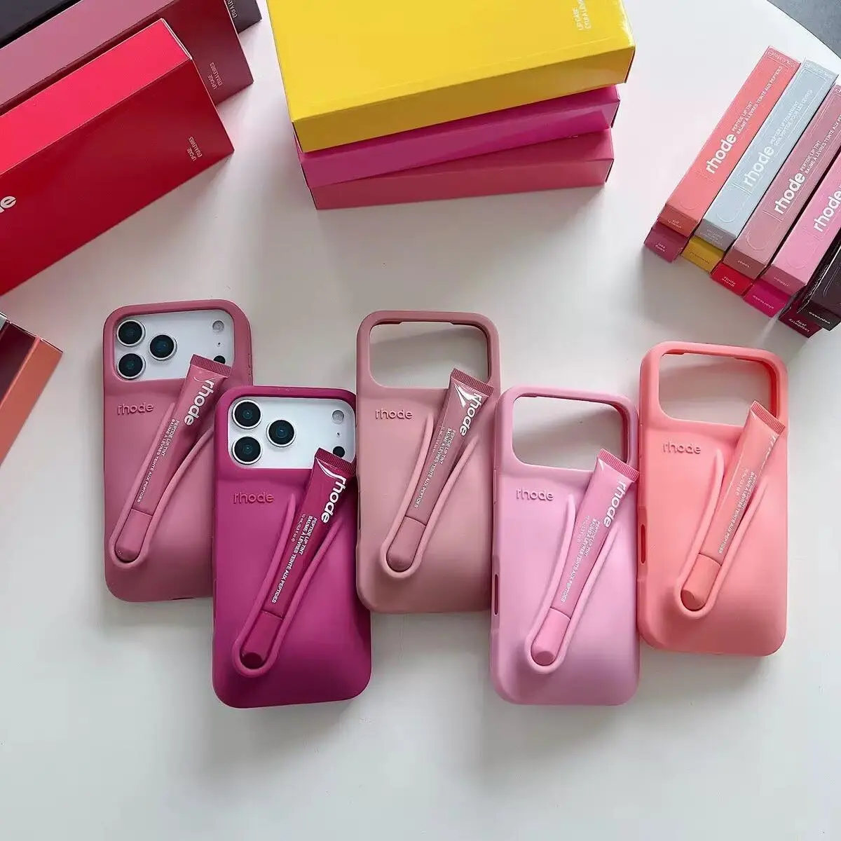 Rhode Hailey Lip Gloss Holder Silicone Phone Case, Portable Lip Balm Slot Protective Cover for iPhone 15/16/17 Pro Max, Cute Candy Color Shockproof Soft Phone Shell Gift for Girls